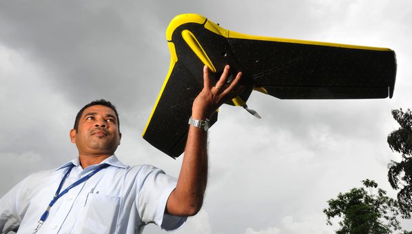 Ranjith Alankara with the IWMI drone for a test flight near Colombo, Sri Lanka Credit: Neil Palmer / IWMI