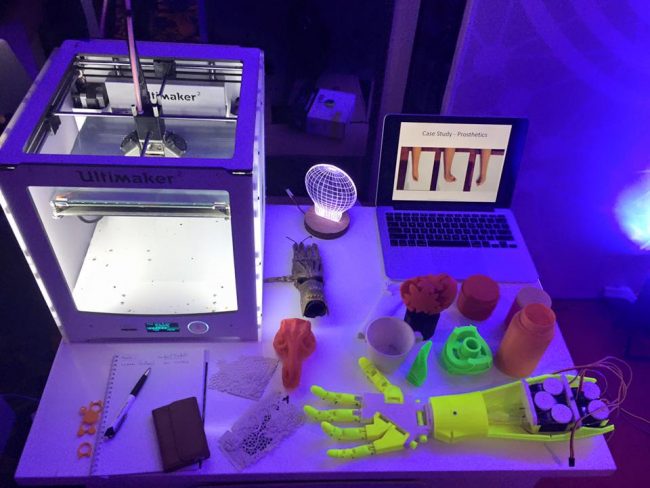 A printer and various test objects. A 3D printed prosthetic arm is also on display. Image credits: 3D Concept Studio